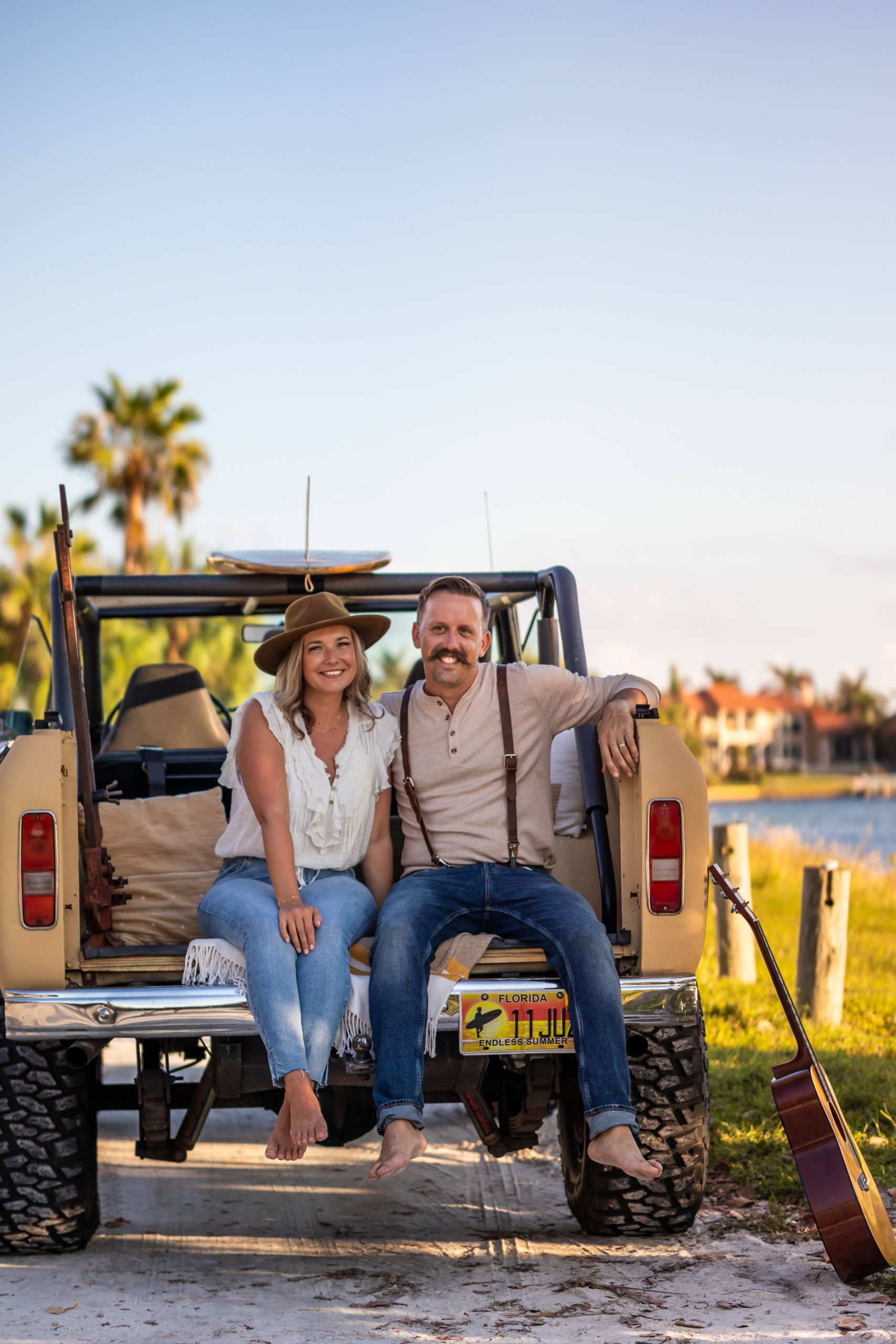 WebInk owners Sean and Kelley Rowe seated on a vintage Scout in Sarasota